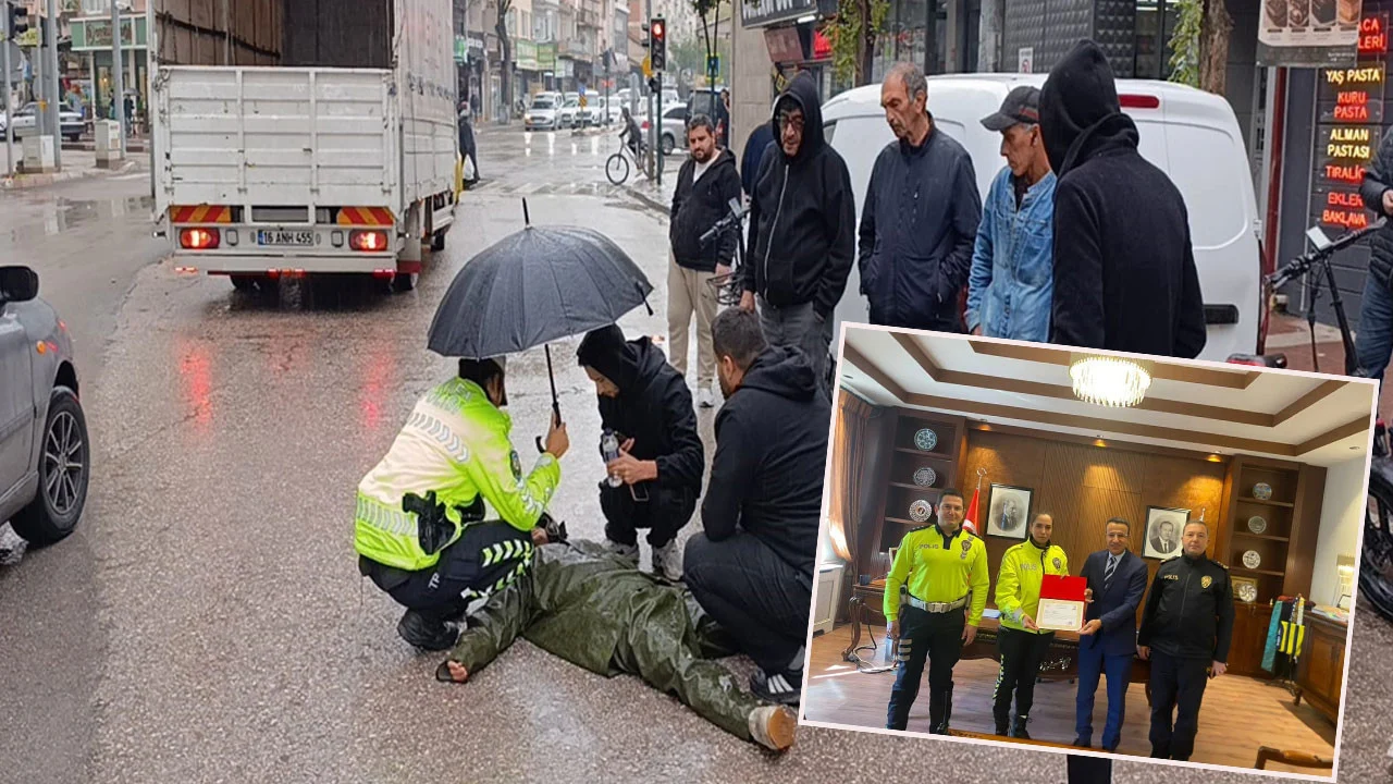 Yağmur altında şefkat nöbeti: Şemsiyeli polise teşekkür yağdı